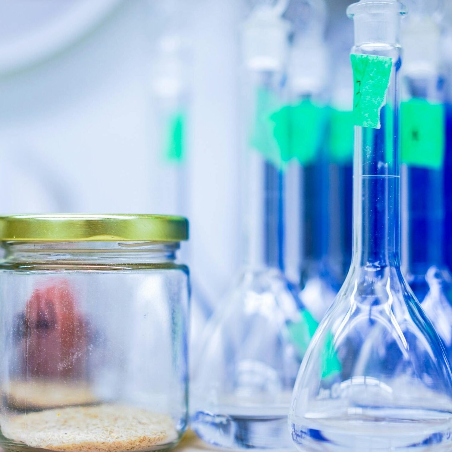 A close-up view of laboratory glassware and jars, used for scientific experiments.